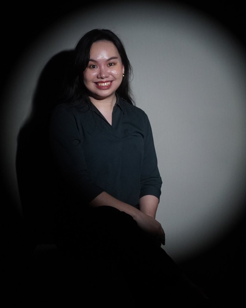 Patricia, founder of Sceptra CFO, smiling in a spotlight